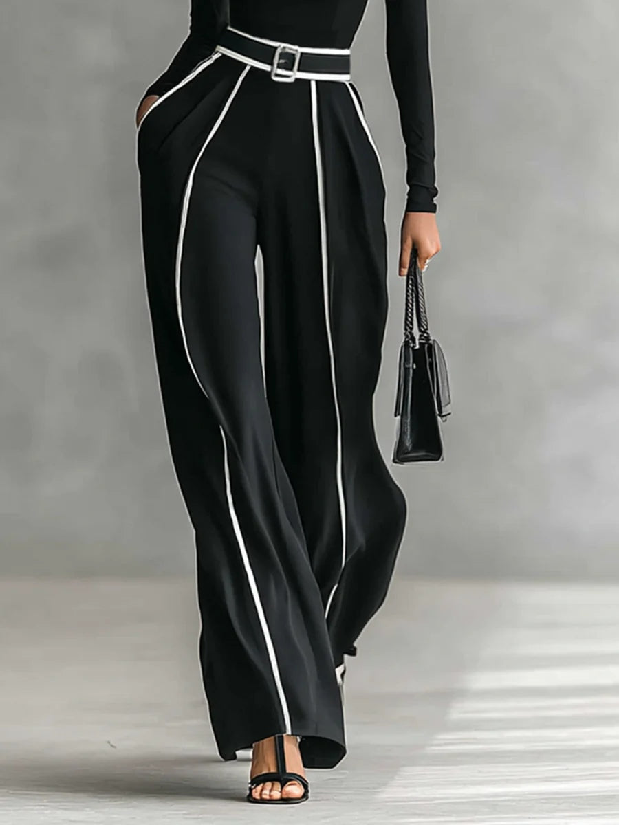 Completo di top a maniche lunghe a collo alto e pantaloni a gamba larga con cintura